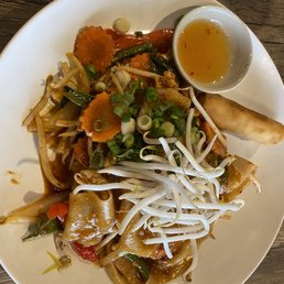 Tuk Tuk Thai Food Loft signature dishes Mieng Kum (Leaf-Wrapped Bites)Khao Soi (Curry Noodle Soup)Neua Sawan (Thai Beef Jerky)Kanom Jeeb (Pork Dumplings)